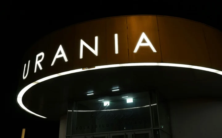 Glowing letters in the dark representing how language models learn action nominal constructions