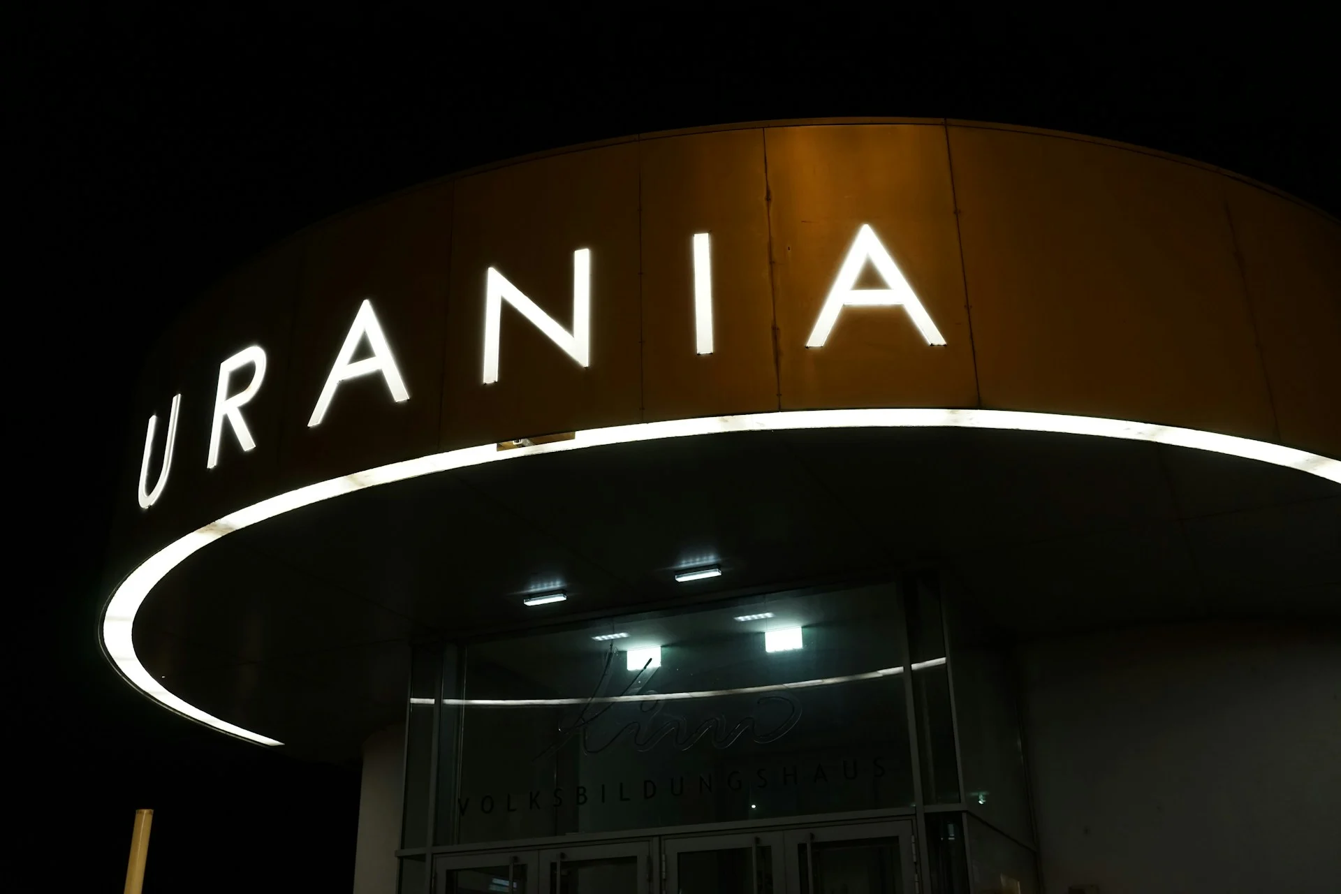 Glowing letters in the dark representing how language models learn action nominal constructions