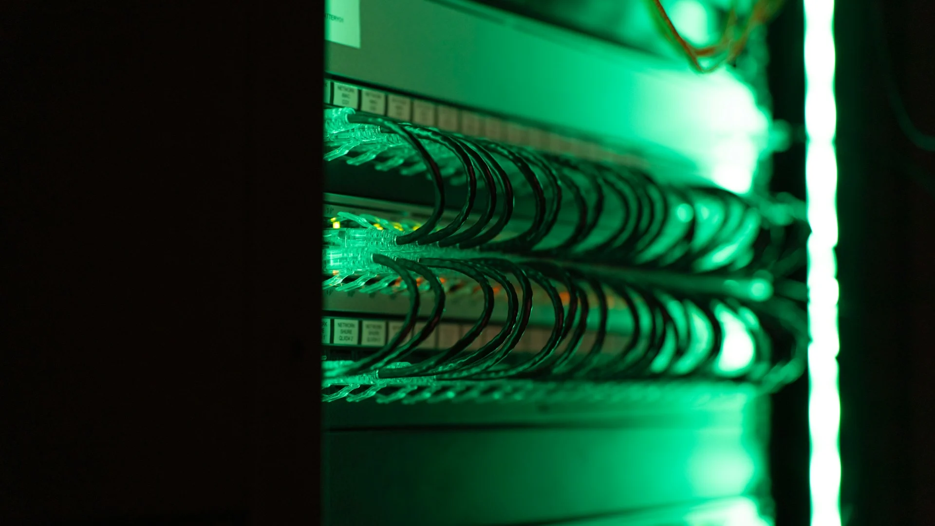 Server racks in blue light representing AI agent evaluation infrastructure
