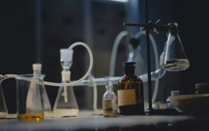 Biohazard laboratory in dramatic low light illustrating the threat of AI bioweapons