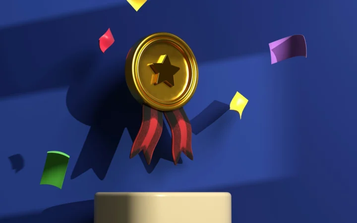 Golden trophy under a spotlight on stage, evoking the Ballon d'Or 2026 ceremony in London
