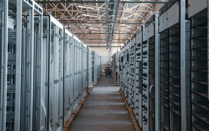 Data center server racks in blue light, illustrating Baseten Mammoth-1 decision models