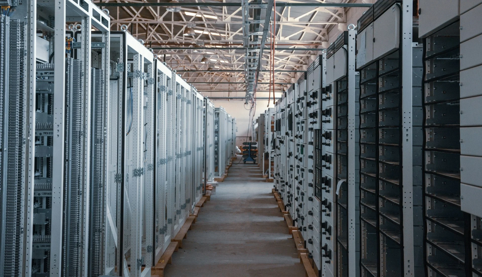 Data center server racks in blue light, illustrating Baseten Mammoth-1 decision models