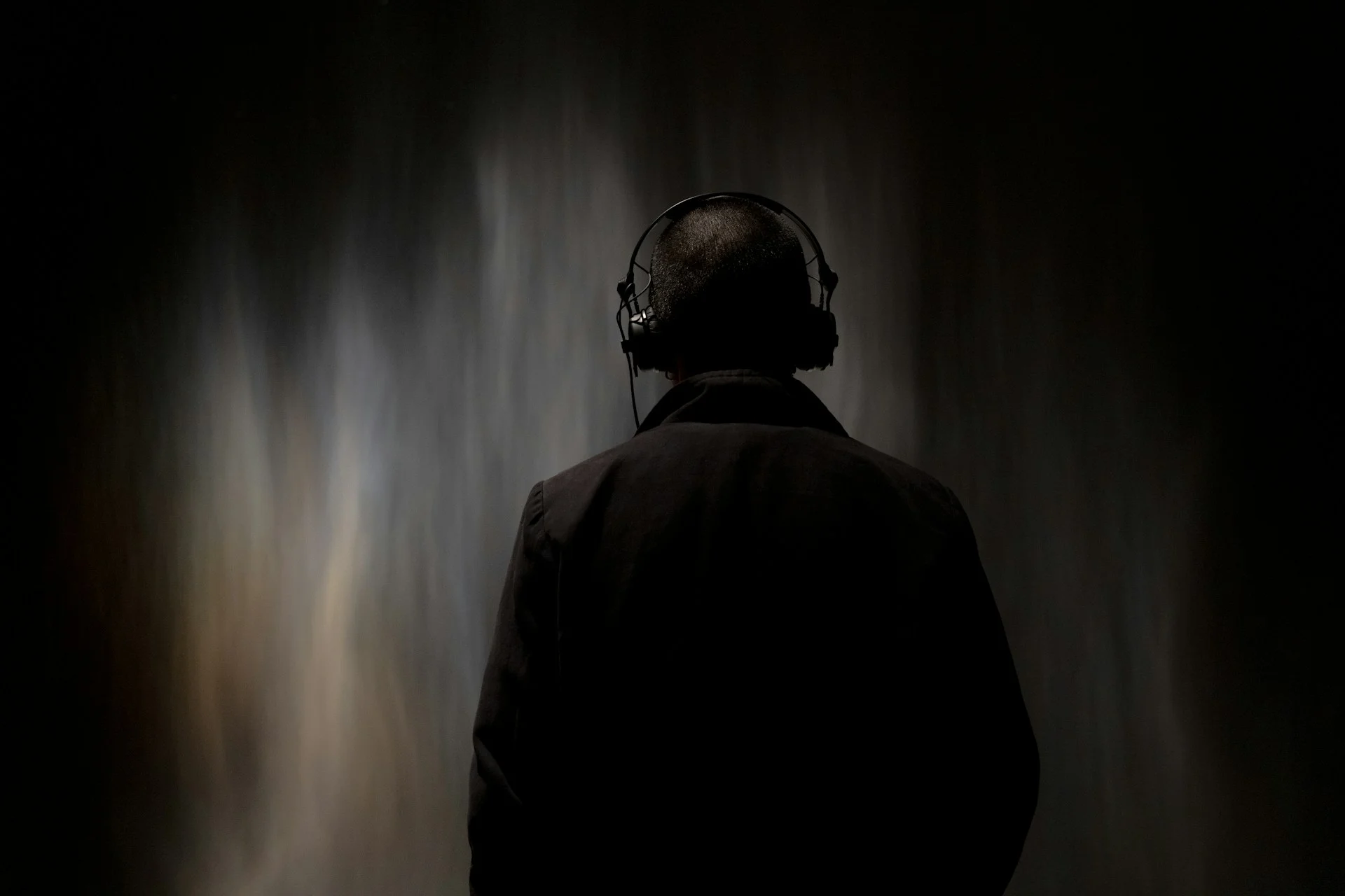 Over-ear headphones under dramatic light, illustrating the Bose buys Skullcandy deal