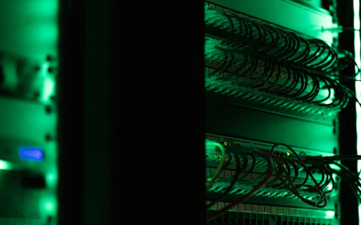 Server room with blue light, the hardware behind CI build speed