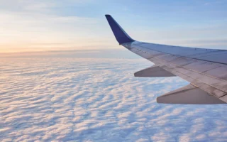 Airliner wing at dramatic sunset, representing the Citi AAdvantage fee increase
