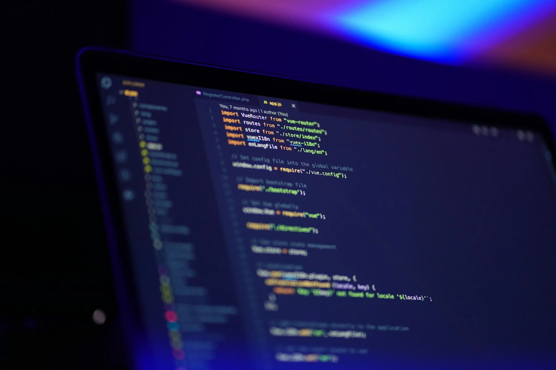 Programmer writing code on a laptop at night, as in the EVEngine AI game engine story