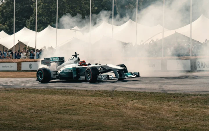 Formula 1 car racing under lights, symbolising F1 on Apple TV in the US