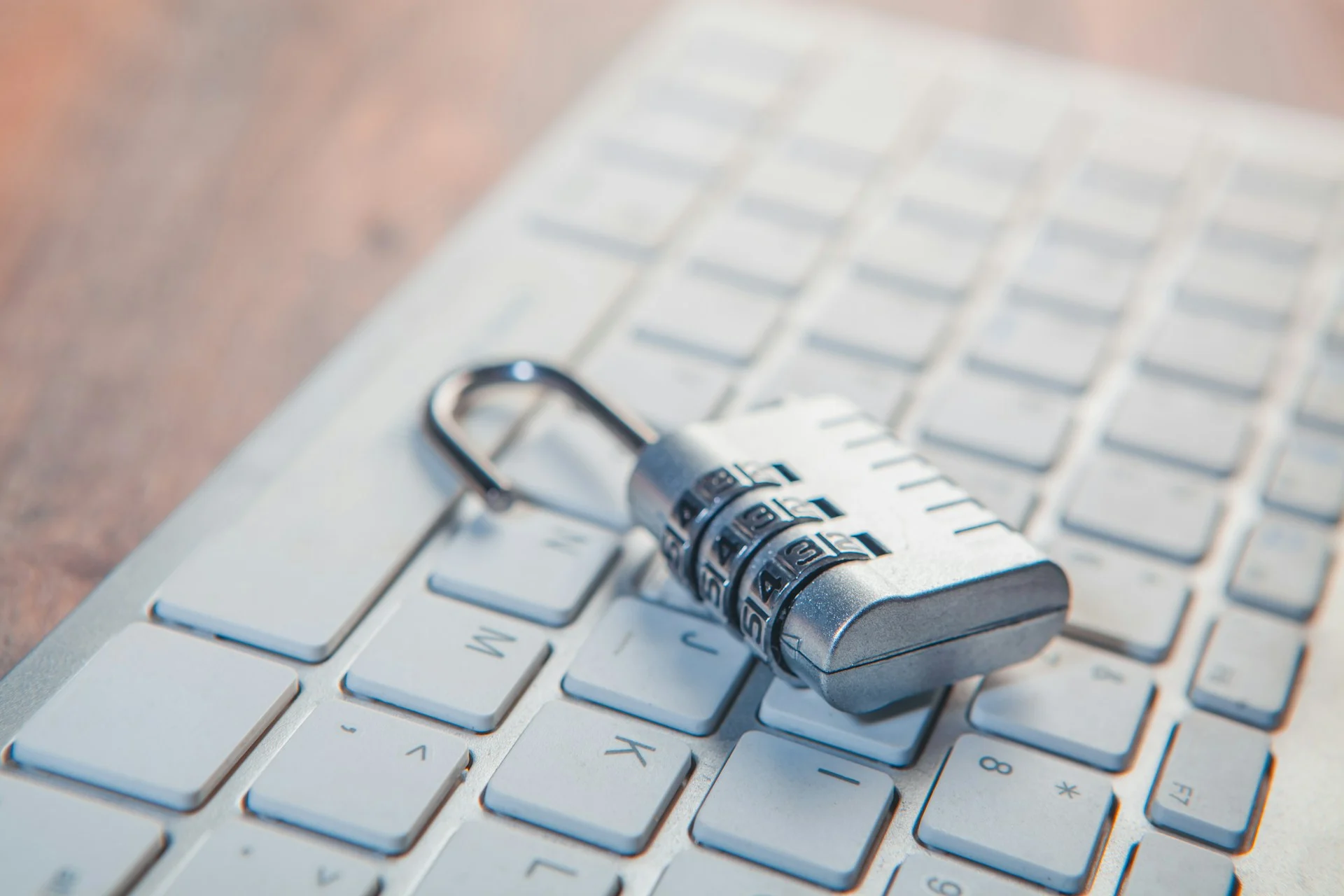 Padlock resting on a laptop keyboard, symbolizing Google Gmail ads and data privacy