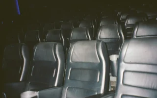 Film projector beam in a dark cinema, symbolising the Grok Odyssey AI film
