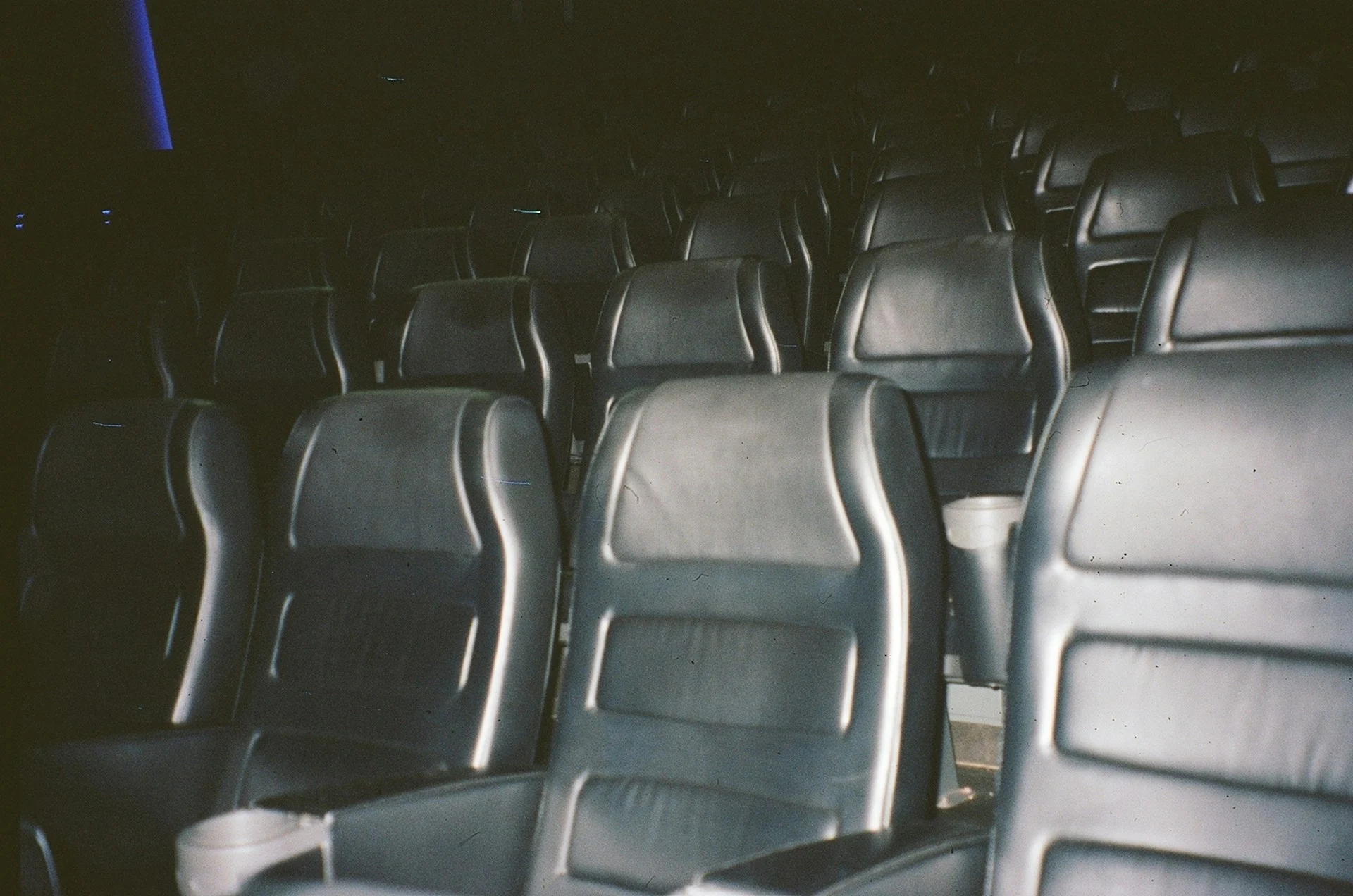 Film projector beam in a dark cinema, symbolising the Grok Odyssey AI film
