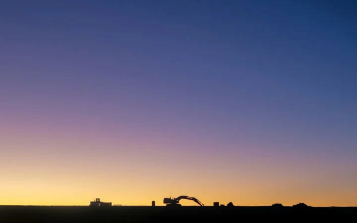 Pipeline construction at sunset, the kind of infrastructure work driving MBB Q3 earnings