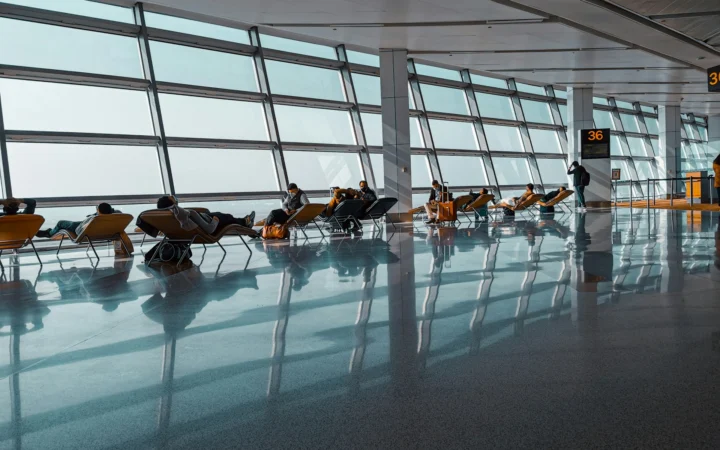 Airport lounge seating area where premium credit card perks include guest access