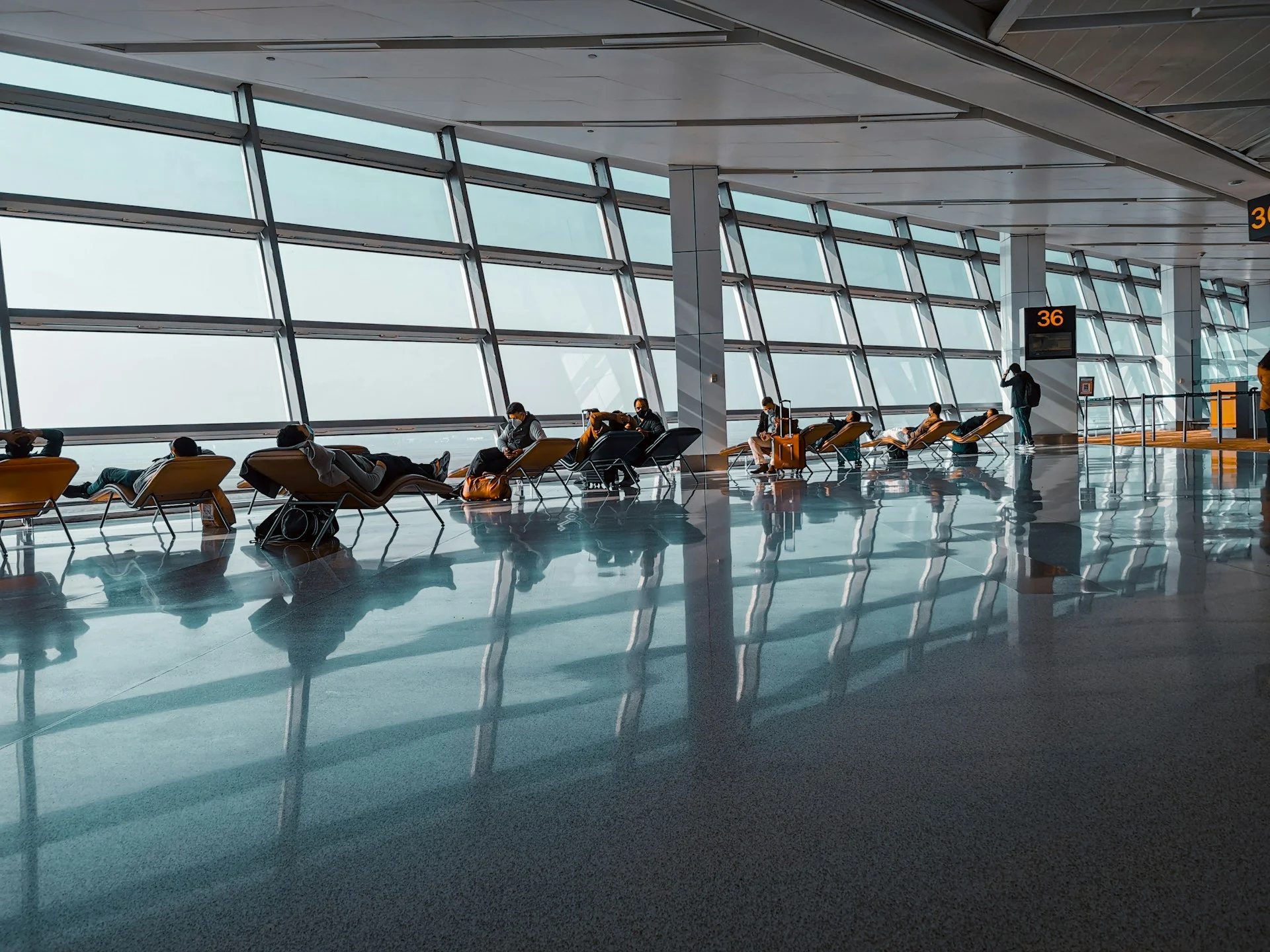 Airport lounge seating area where premium credit card perks include guest access