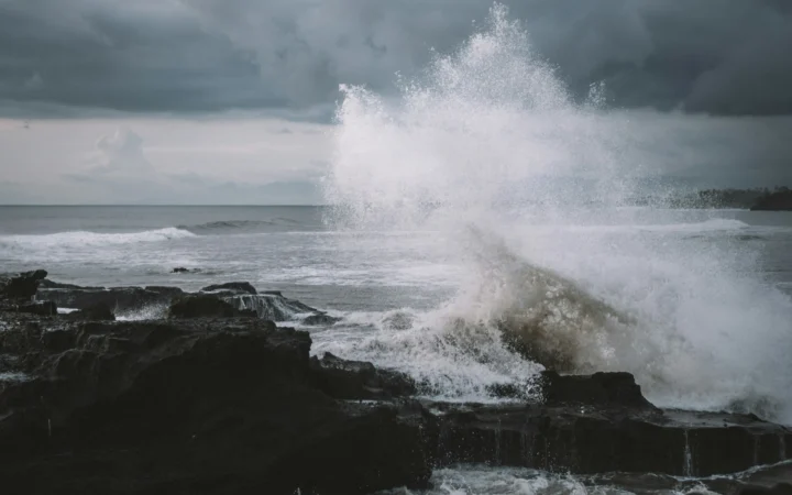 Huge storm waves crashing against a coastline, the force a salt marsh must absorb