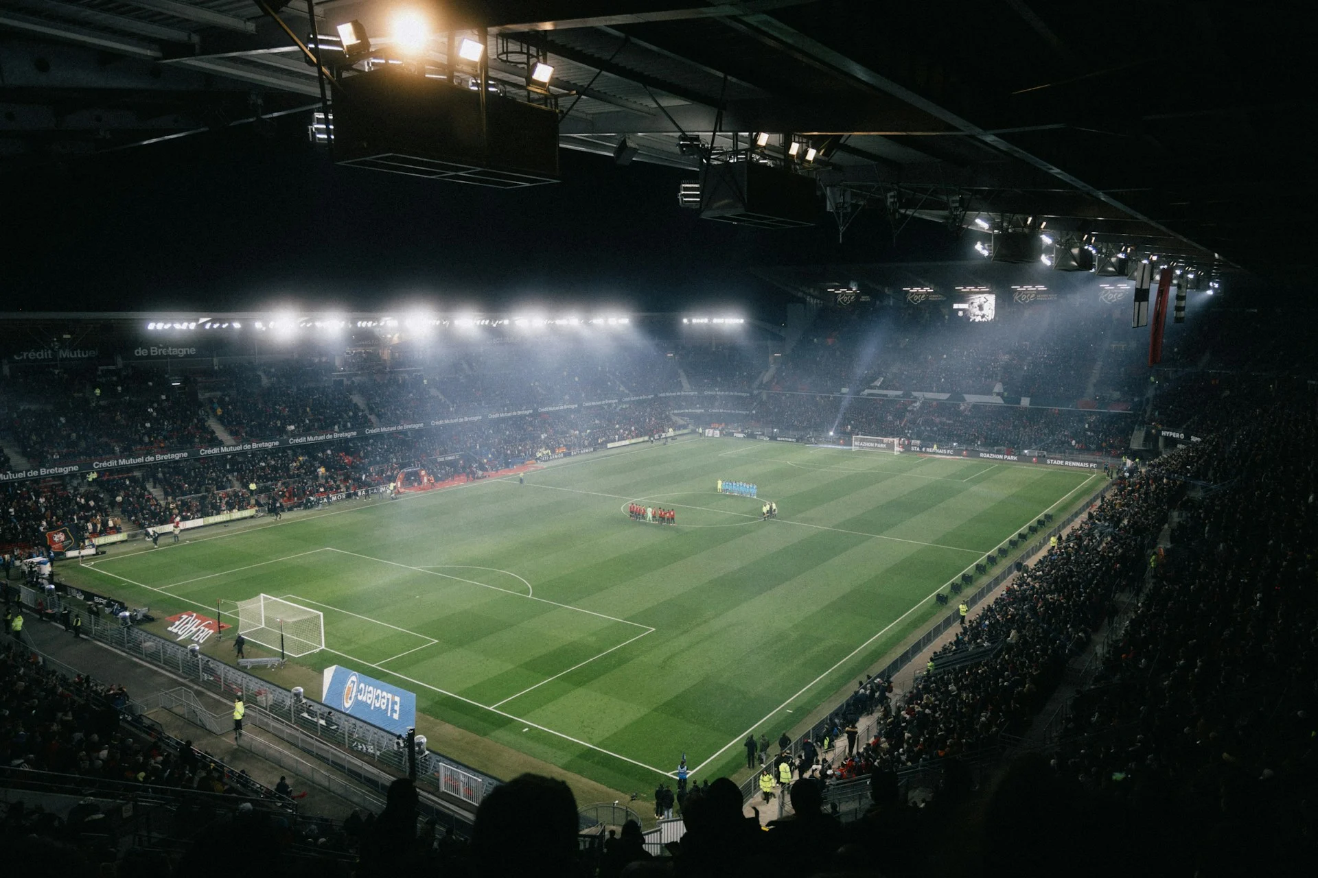 Football stadium under floodlights at night, the stage for Sauce Gardner's Colts