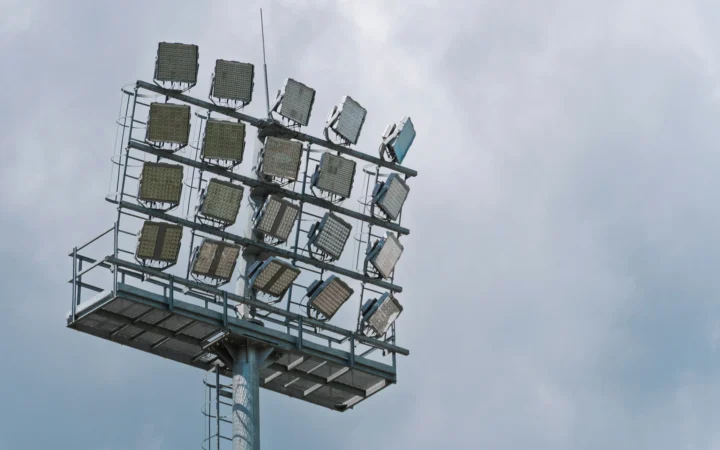 Football stadium floodlights lit at night, marking the Socrates Award story