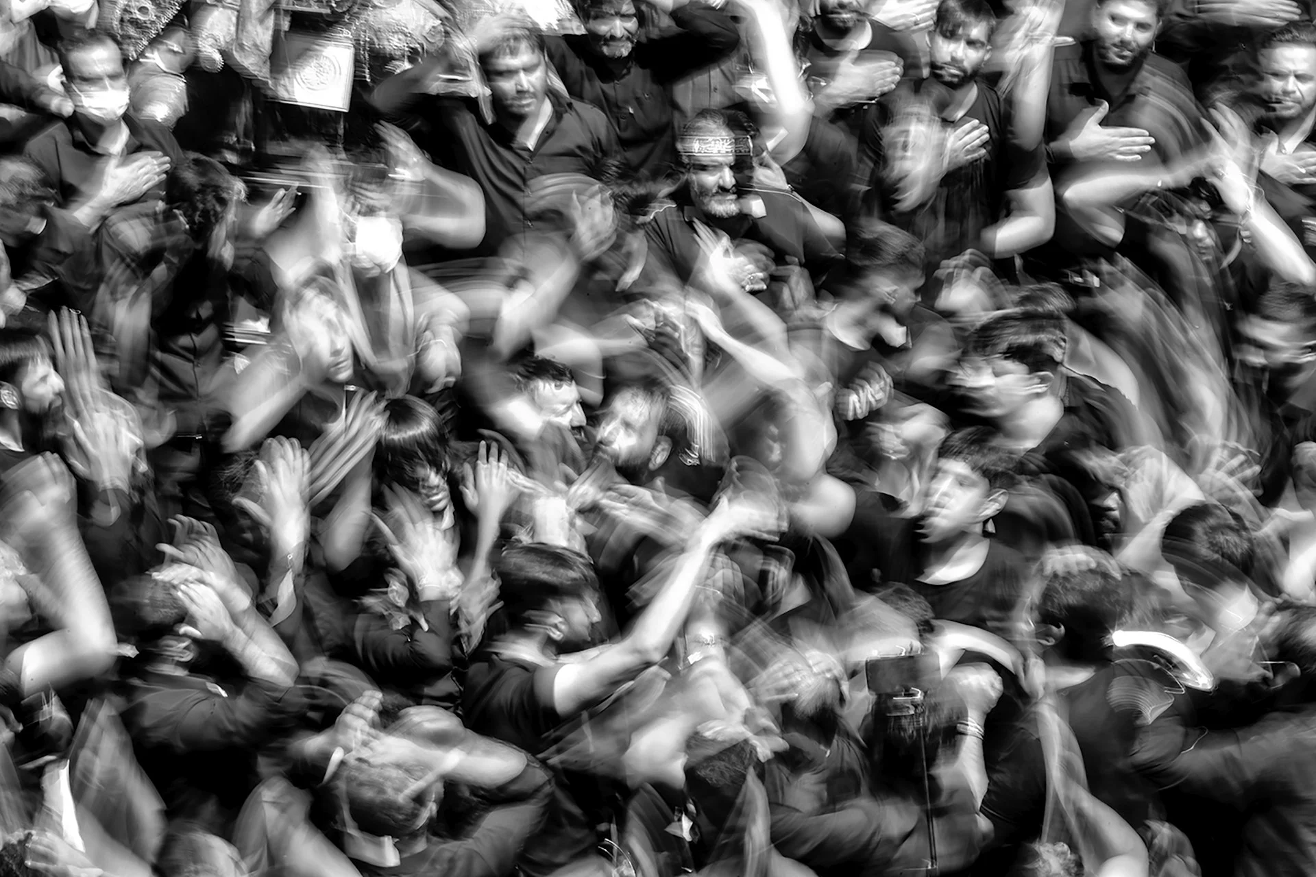 Crowd lit by dramatic light, representing the populations synthetic survey respondents try to simulate