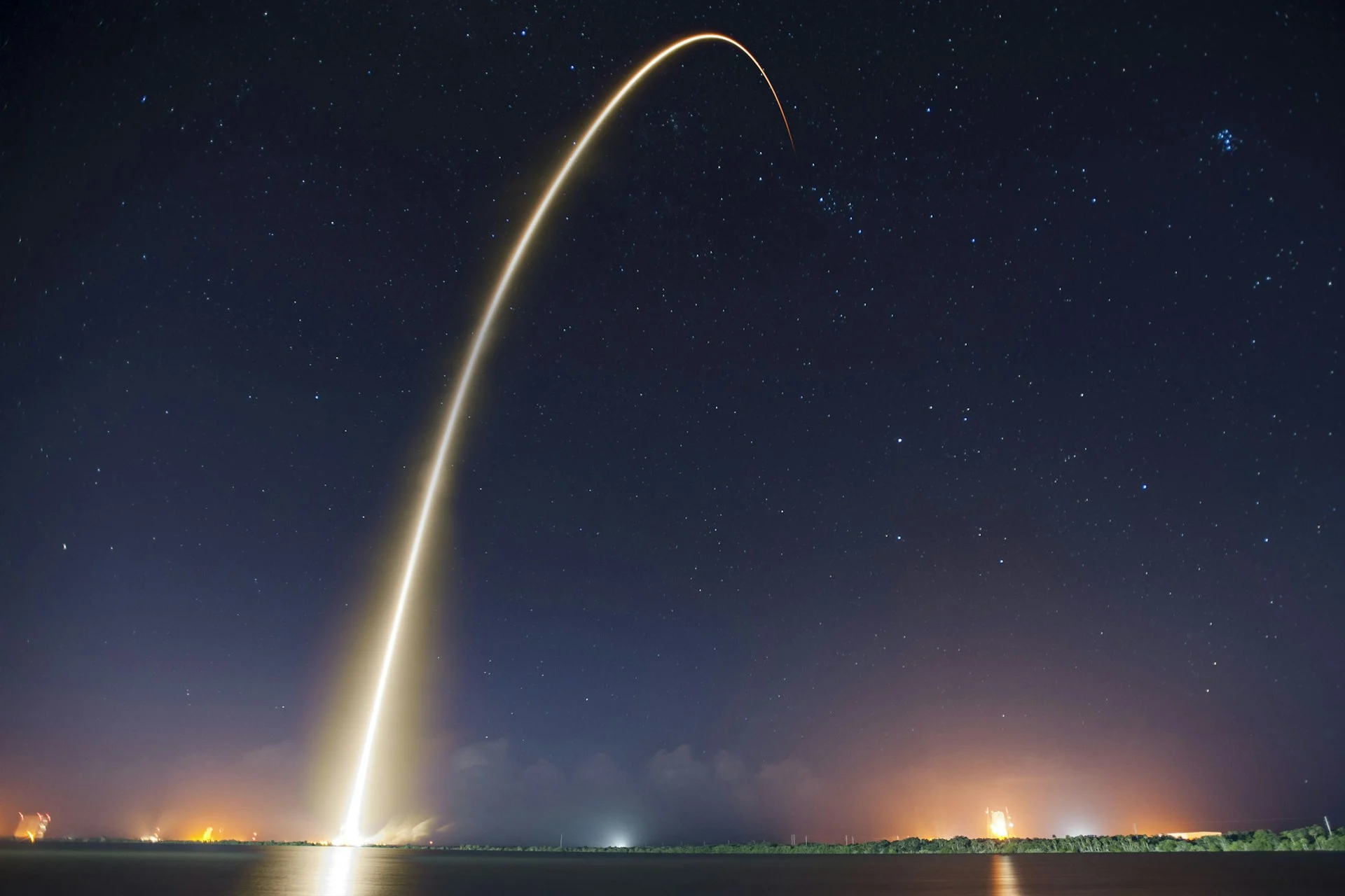 Rocket launching at night, a symbol of long-promised tech promises