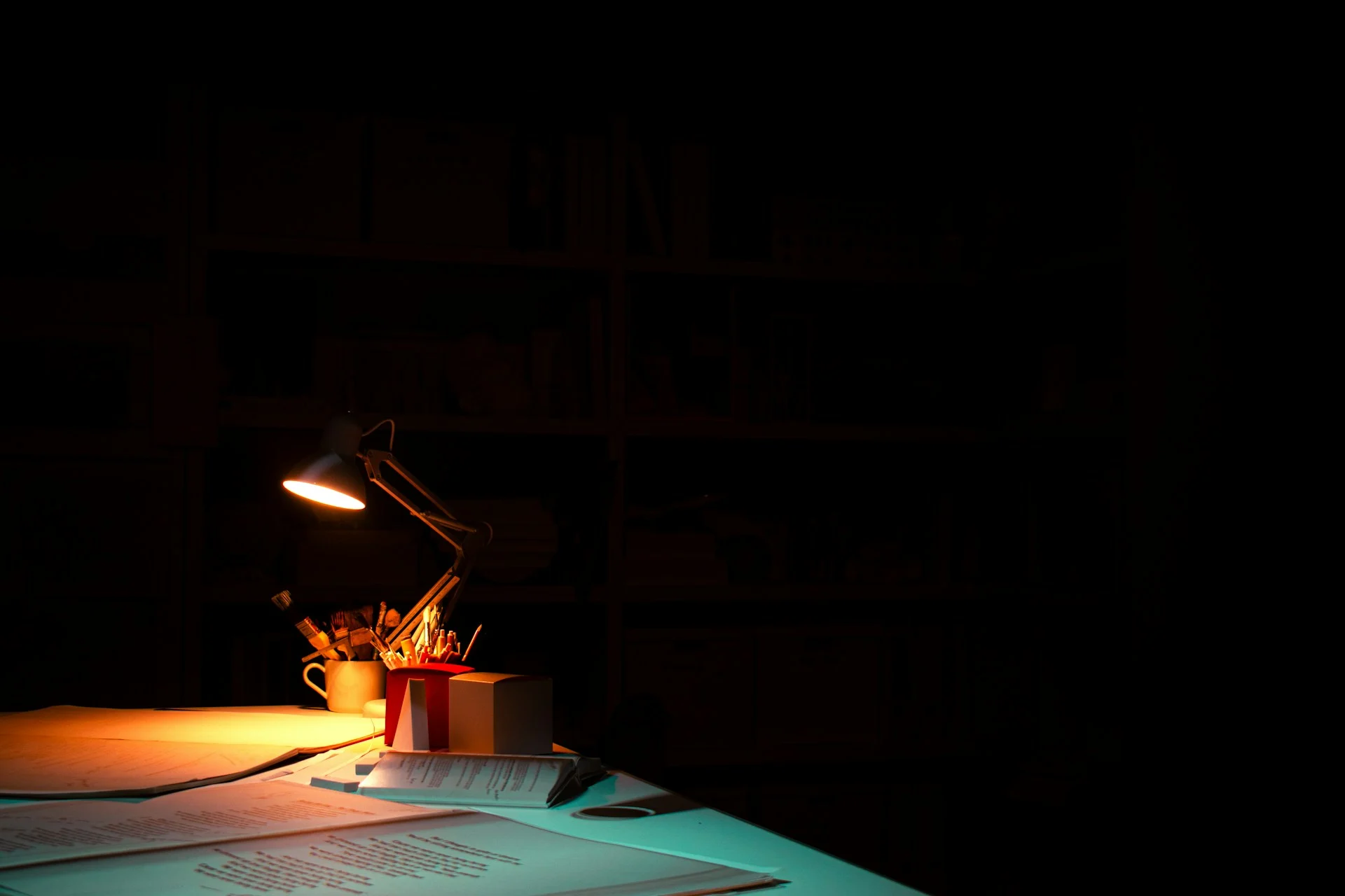 Smartphone glowing on a dark desk, the kind of device a Town AI assistant runs on