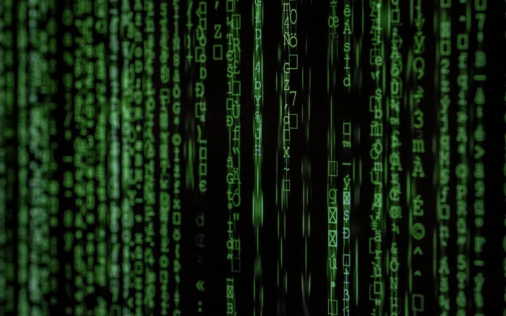 Glowing code on a dark screen, illustrating vlmhub for vision-language models