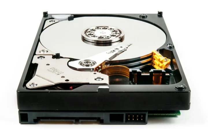 Close-up of a hard disk drive platter and read arm, symbolising Western Digital earnings