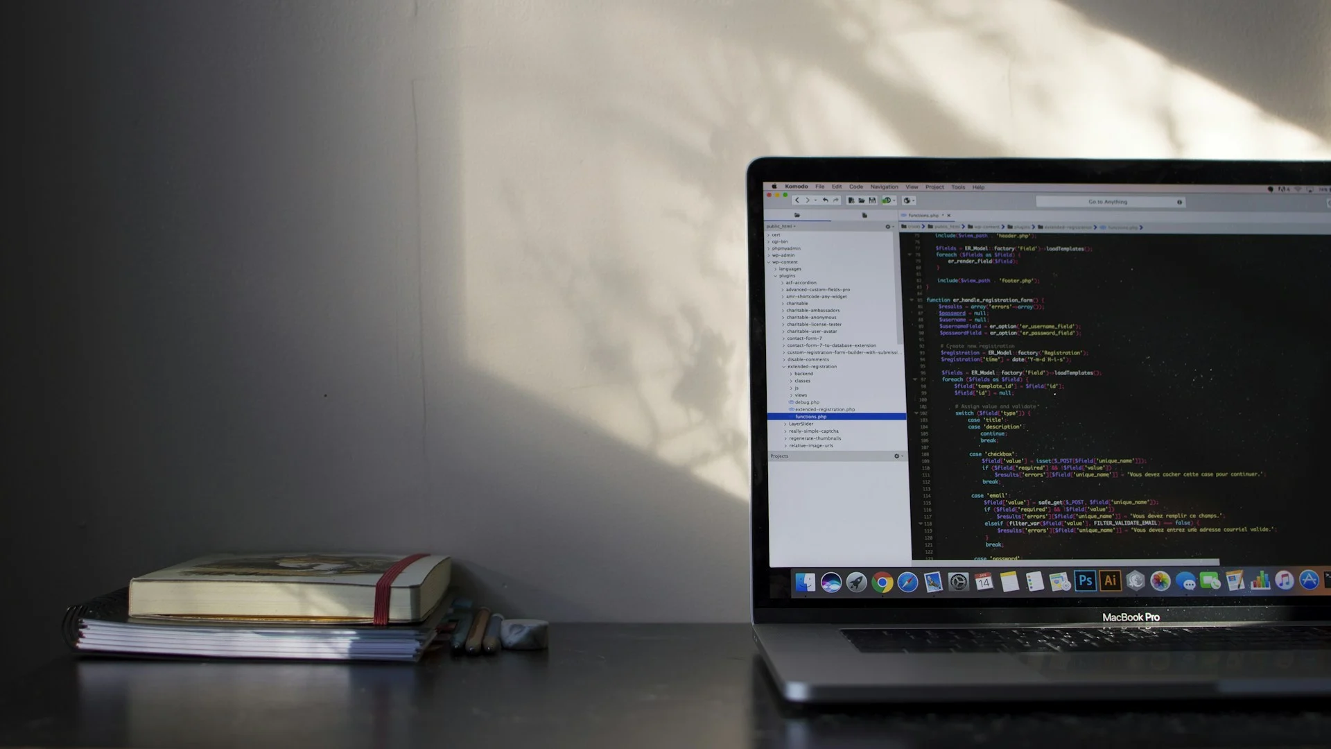 Developer laptop showing code on a dark screen